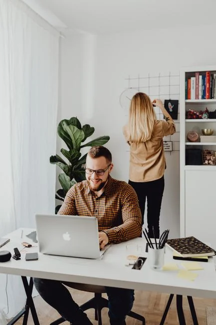A contemporary workspace showcasing a laptop, tablet, and smartphones, ideal for tech and freelance use.
