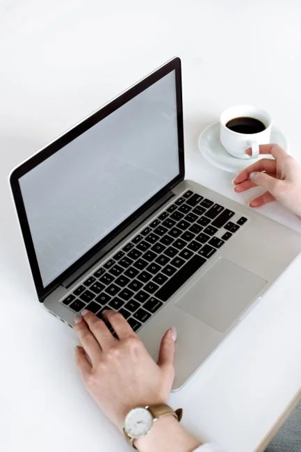 A modern computer screen displaying web design work, showcasing creative visuals in a workspace.
